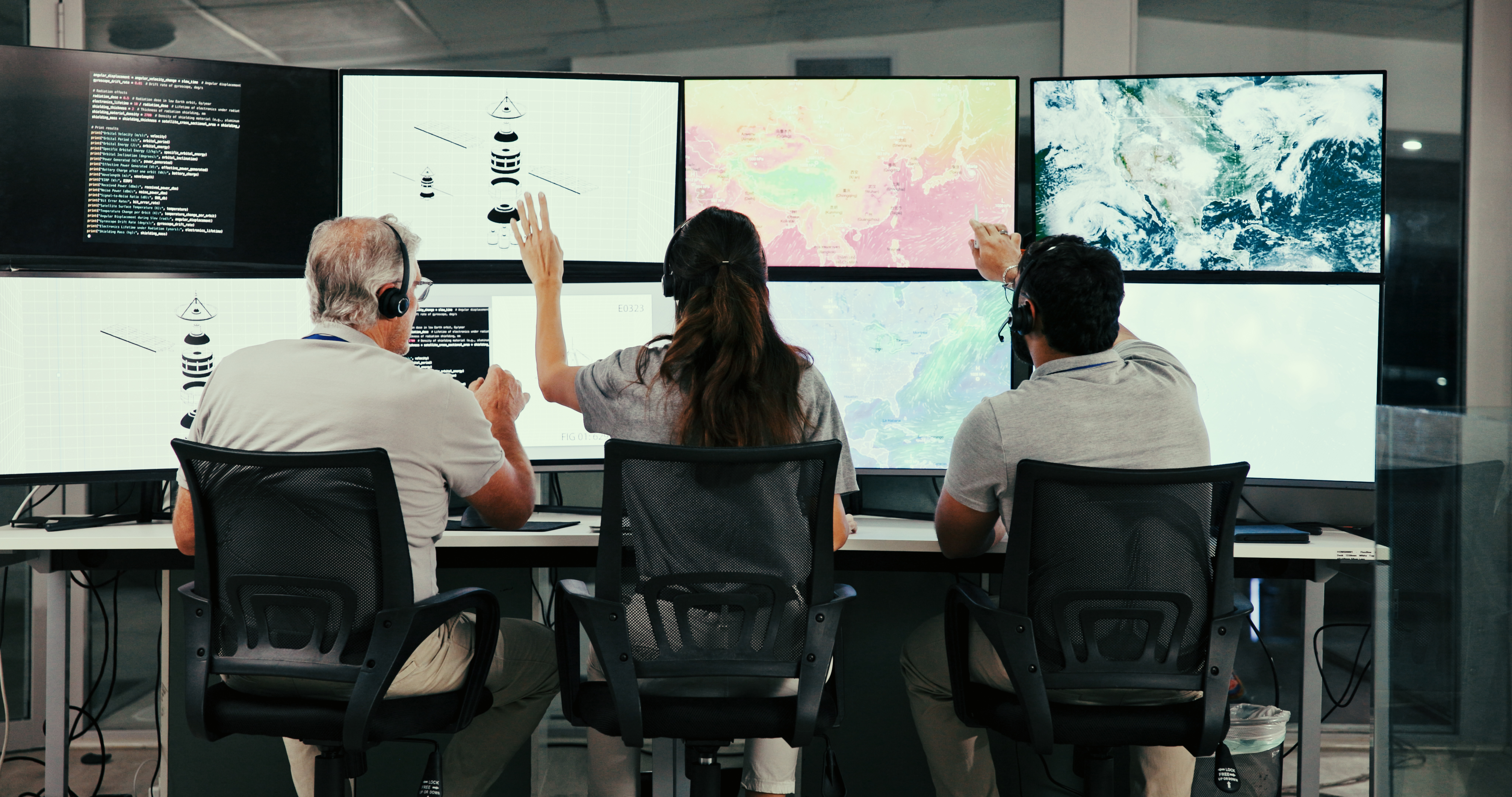 three operators monitoring complex data in a moder utc
